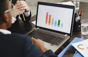 Laptop showing financial charts