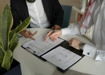 Business professional reviewing supplier documents